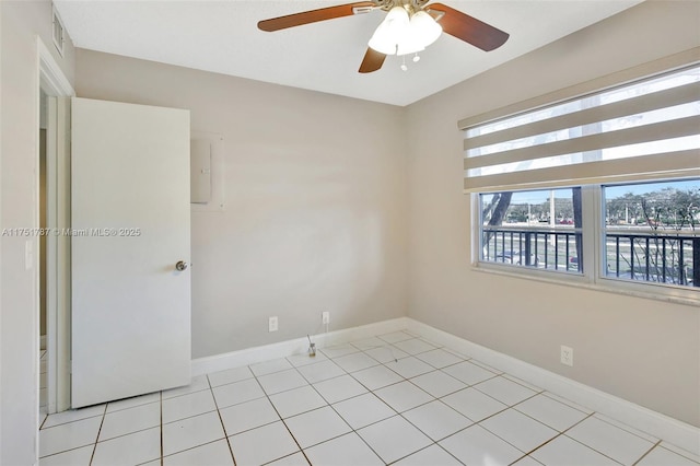 unfurnished room with visible vents, baseboards, and light tile patterned flooring