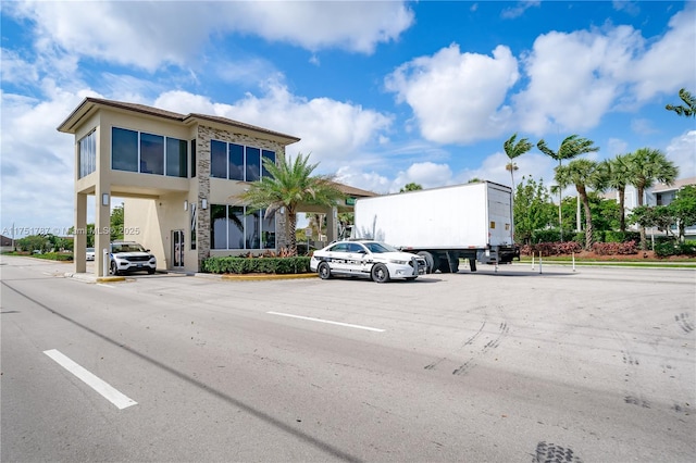 view of property with uncovered parking