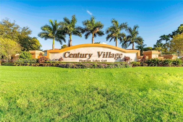 community / neighborhood sign with a lawn