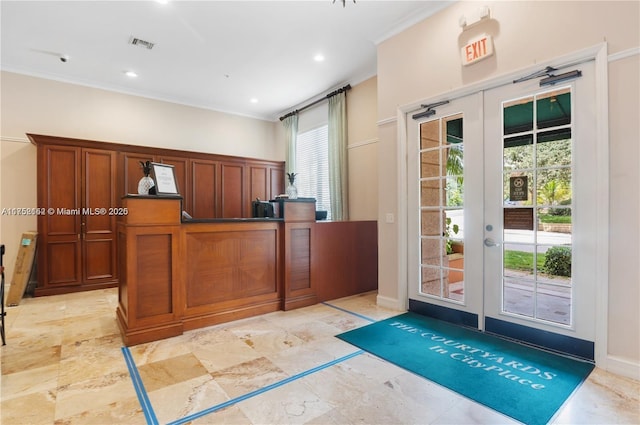 interior space featuring recessed lighting, french doors, visible vents, and crown molding