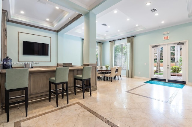 bar featuring baseboards, visible vents, a tray ceiling, crown molding, and recessed lighting