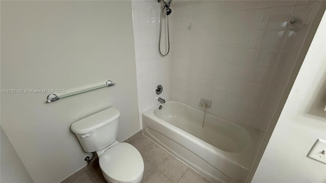 bathroom featuring tile patterned flooring, shower / bath combination, and toilet