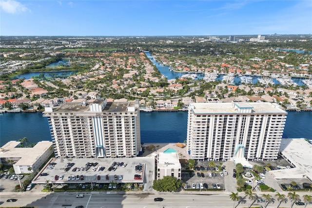 drone / aerial view with a view of city and a water view