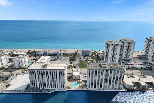 birds eye view of property featuring a view of city and a water view