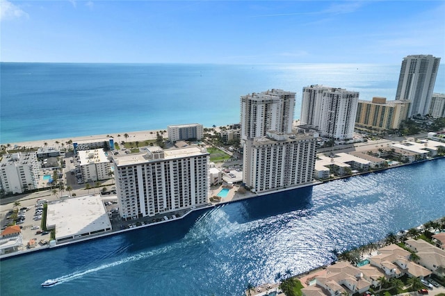 drone / aerial view with a view of city and a water view