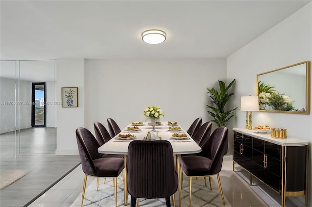 dining room featuring baseboards