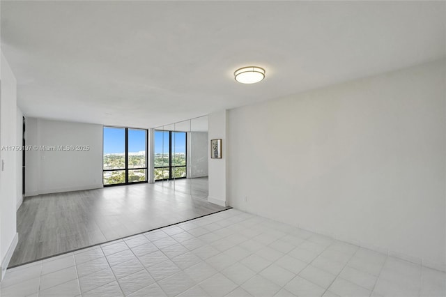 spare room featuring expansive windows