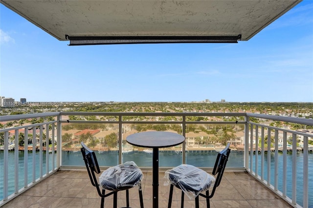 balcony featuring a water view