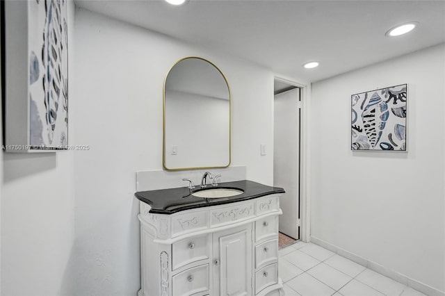 bathroom with tile patterned floors, recessed lighting, baseboards, and vanity