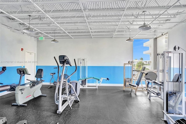 workout area featuring baseboards