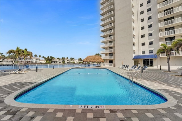 pool featuring a patio and a gazebo