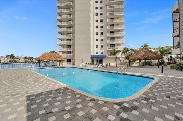 pool featuring a patio and a gazebo