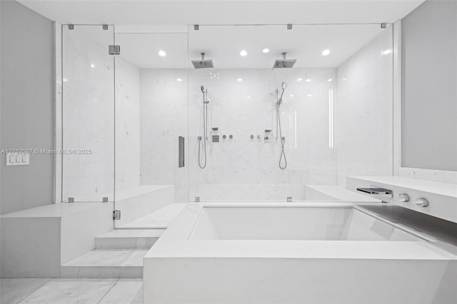 bathroom featuring recessed lighting, marble finish floor, a shower stall, and a bath