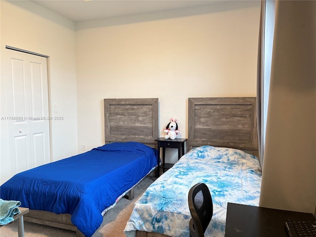 carpeted bedroom featuring a closet