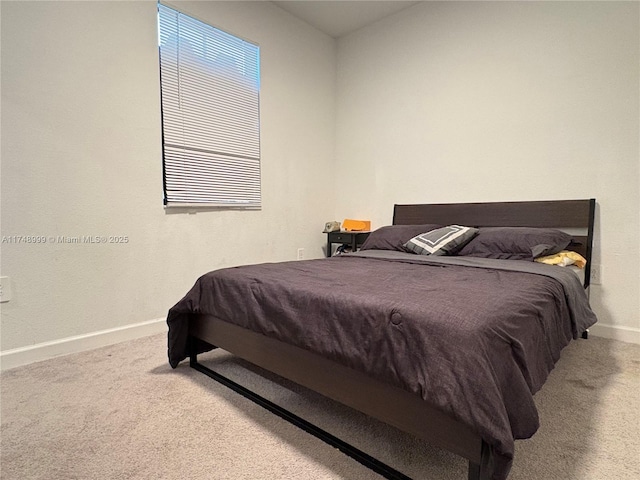 bedroom with carpet flooring and baseboards