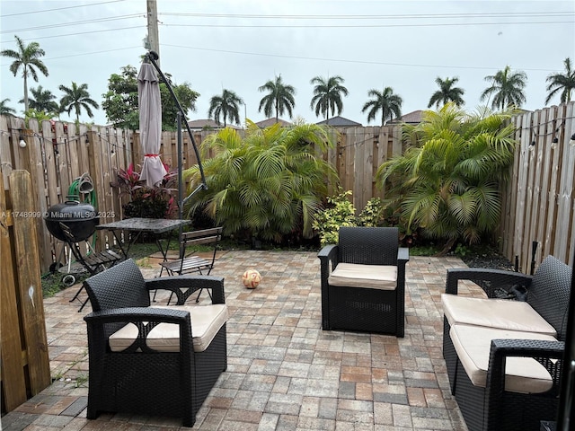 view of patio featuring area for grilling and a fenced backyard