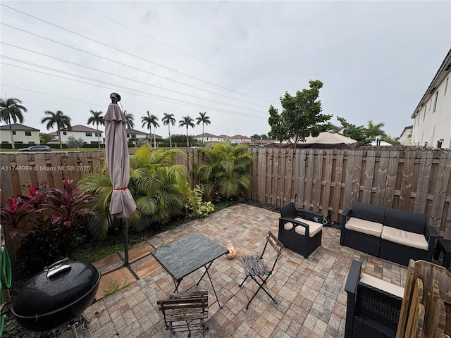 view of patio / terrace featuring an outdoor hangout area and a fenced backyard