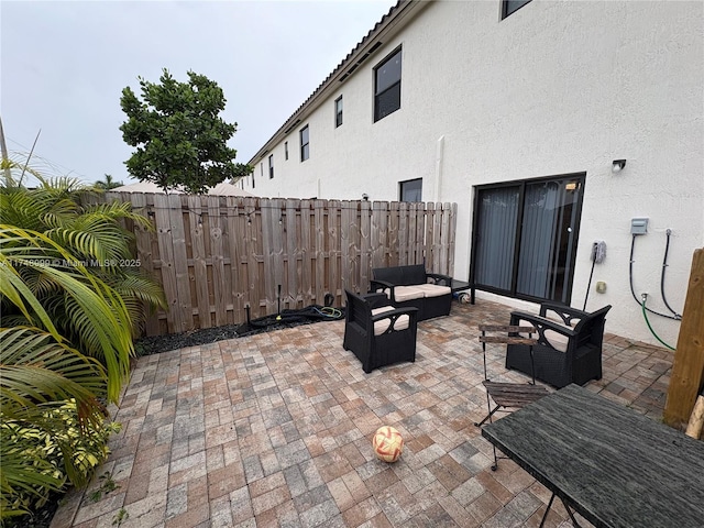 view of patio with fence and an outdoor living space