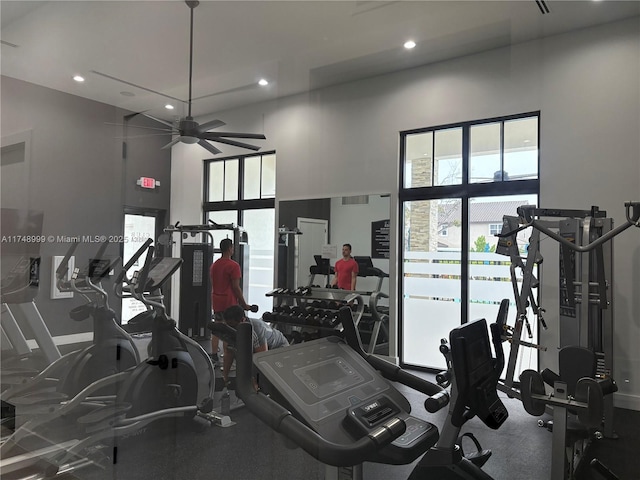 workout area featuring a ceiling fan and recessed lighting