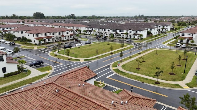 birds eye view of property with a residential view