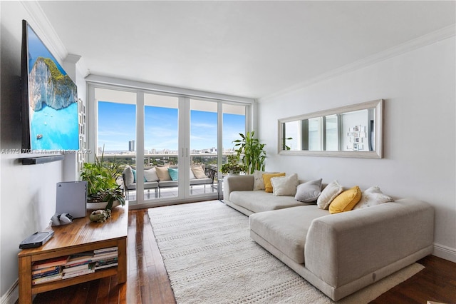 living area featuring ornamental molding, floor to ceiling windows, baseboards, and wood finished floors