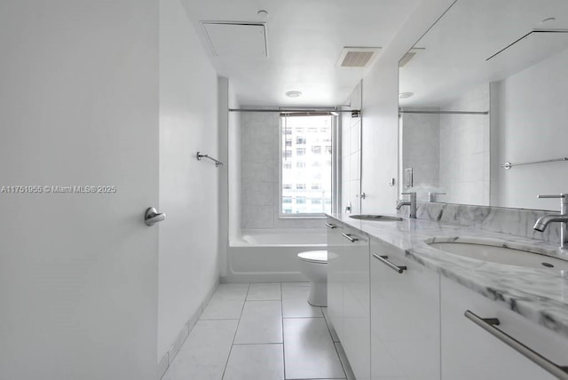 bathroom featuring visible vents, a sink, toilet, and tile patterned floors