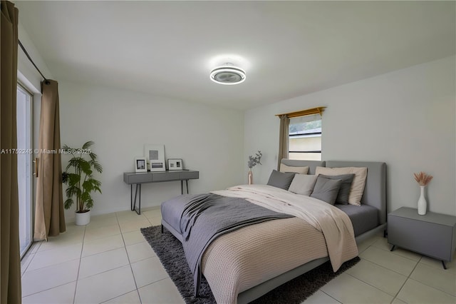 bedroom featuring light tile patterned floors