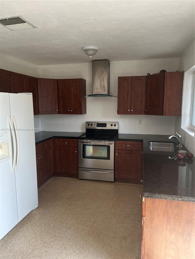 kitchen featuring a sink, visible vents, stainless steel range with electric cooktop, wall chimney exhaust hood, and white fridge with ice dispenser