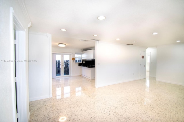interior space with visible vents, recessed lighting, speckled floor, and baseboards