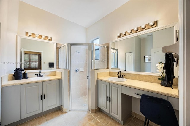 bathroom with two vanities, a sink, and a shower stall