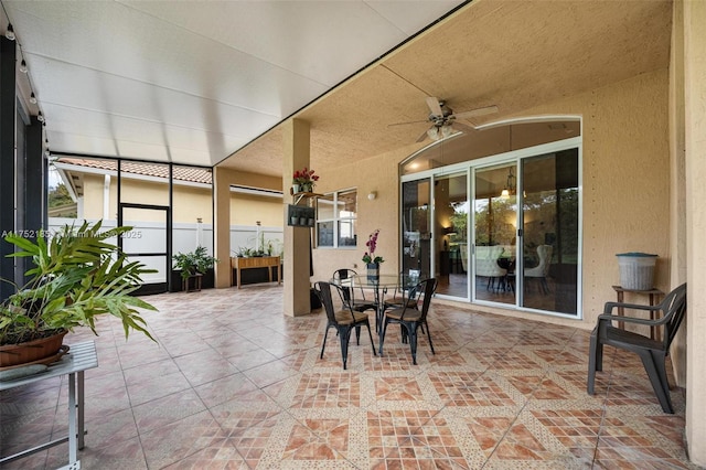 sunroom with a ceiling fan