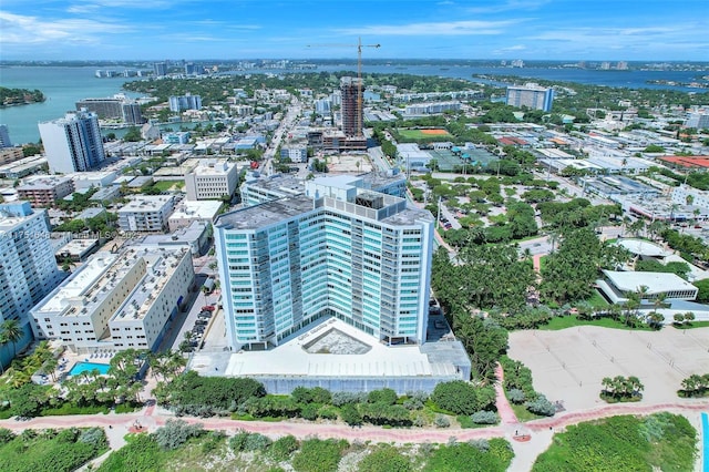 birds eye view of property featuring a view of city and a water view