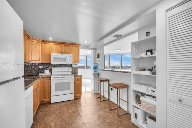 kitchen with recessed lighting, white appliances, visible vents, open shelves, and tasteful backsplash