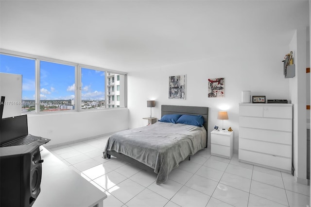 bedroom with light tile patterned floors