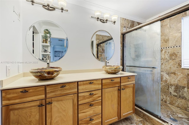 bathroom featuring ornamental molding, a stall shower, and vanity