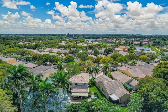 bird's eye view featuring a water view and a residential view