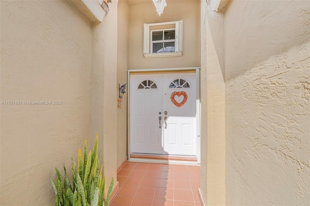 doorway to property with stucco siding