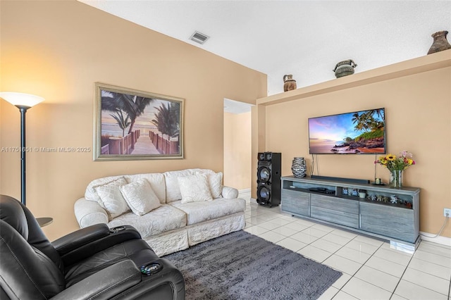 living area featuring light tile patterned floors and visible vents