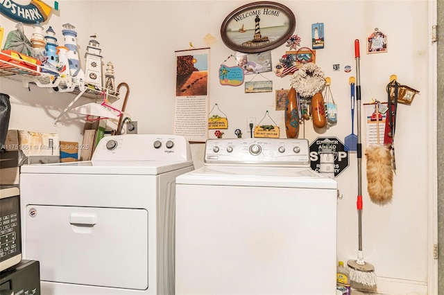 laundry room with laundry area and washer and clothes dryer