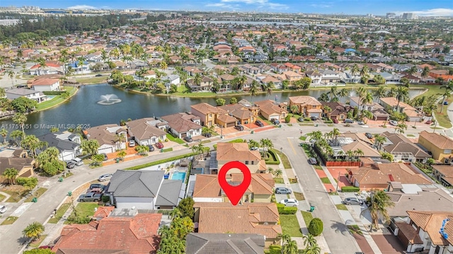 aerial view with a residential view and a water view