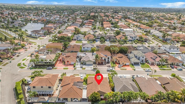 aerial view with a water view and a residential view