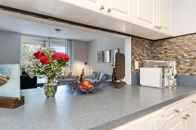 interior space with dark countertops and white cabinets