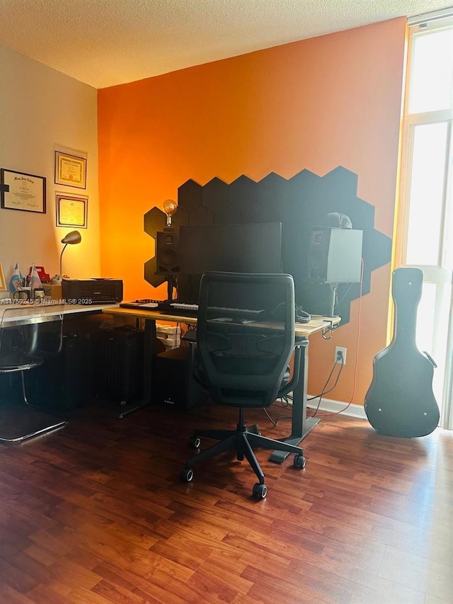 office with a textured ceiling and wood finished floors