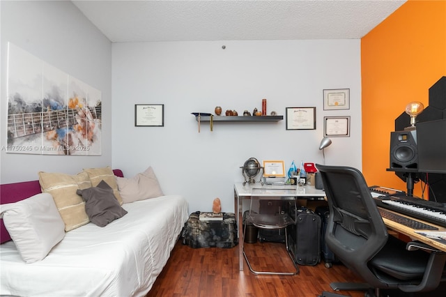 office space featuring a textured ceiling and wood finished floors