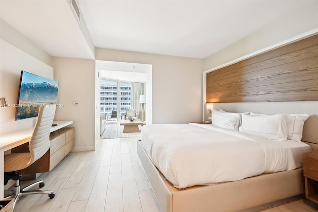 bedroom with light wood finished floors