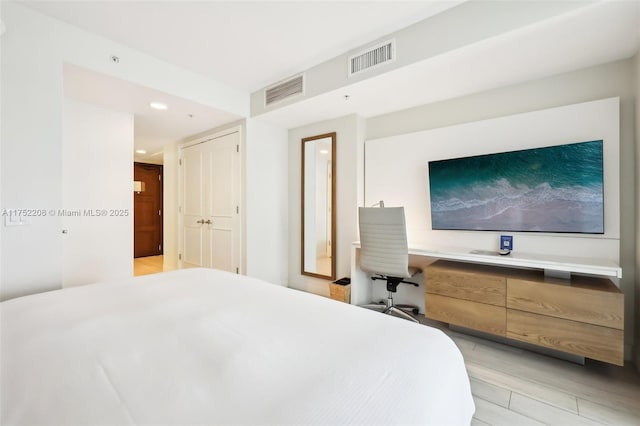 bedroom with recessed lighting and visible vents