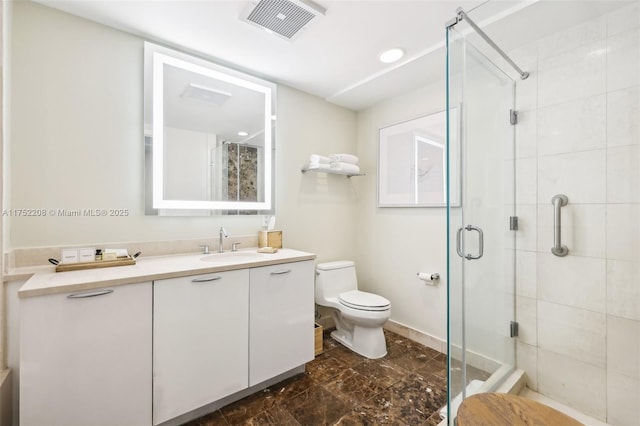 full bath with toilet, a stall shower, vanity, and visible vents