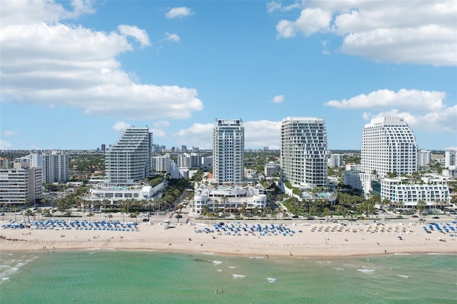 view of city with a water view and a beach view