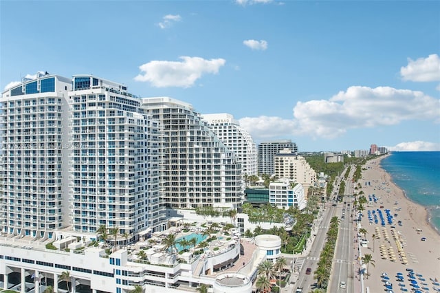 bird's eye view with a water view, a beach view, and a city view