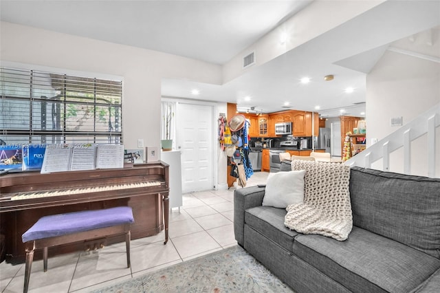 living room featuring recessed lighting, visible vents, and light tile patterned flooring